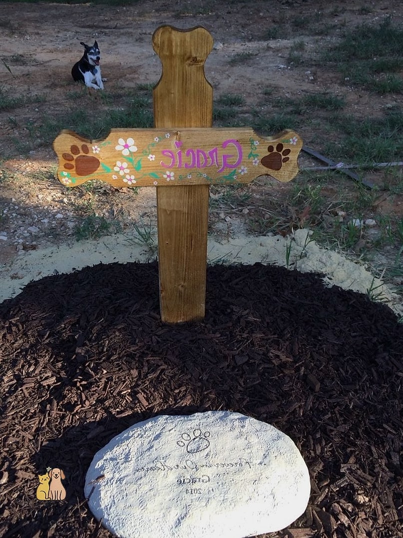 A Wooden Cross or Marker with Wood-Burned Details